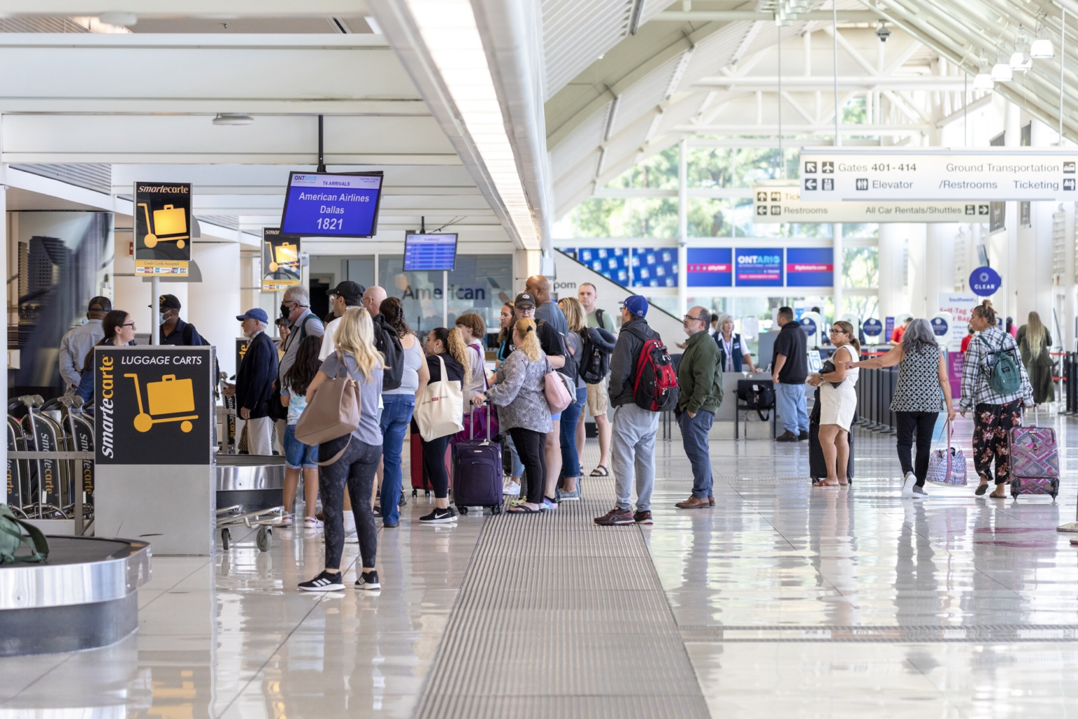 Travelers await to drop off their luggage at Ontario International Airport in Ontario, California in this undated promotional image provided by the airport.