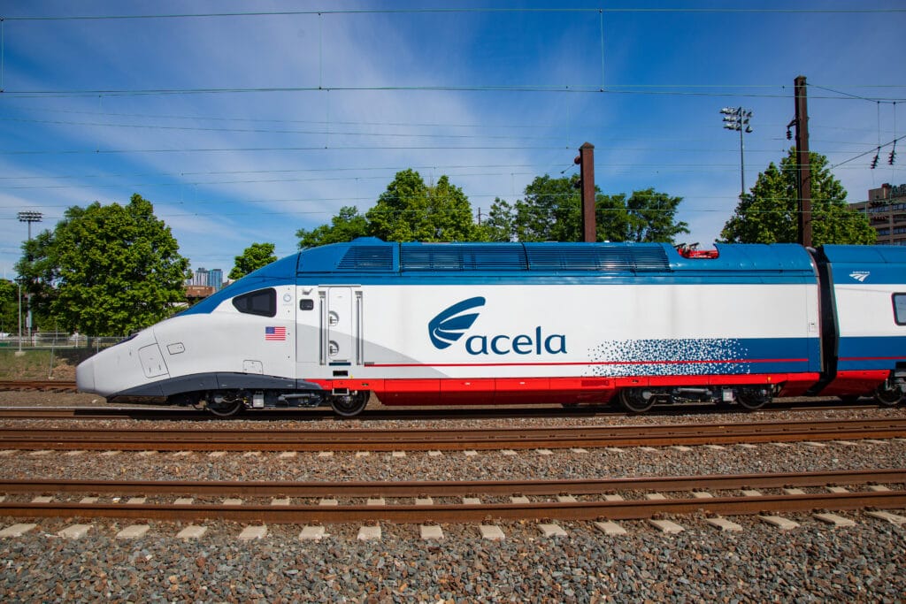 Exterior image of an Amtrak NextGen Acela train operating in the Northeast Corridor. (Amtrak)