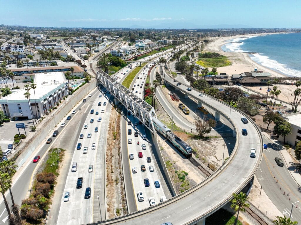 A Metrolink train crosses over Highway 101 in downtown Ventura in this undated promotional image from Metrolink.