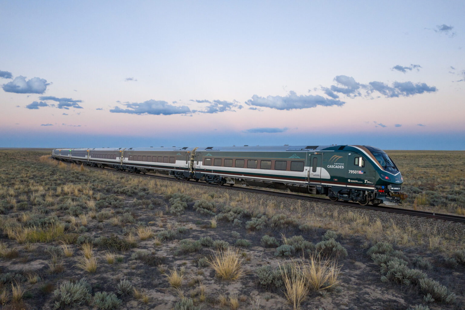 An Amtrak Airo train with the Cascades route color scheme and branding is seen in this undated promotional image from Amtrak.